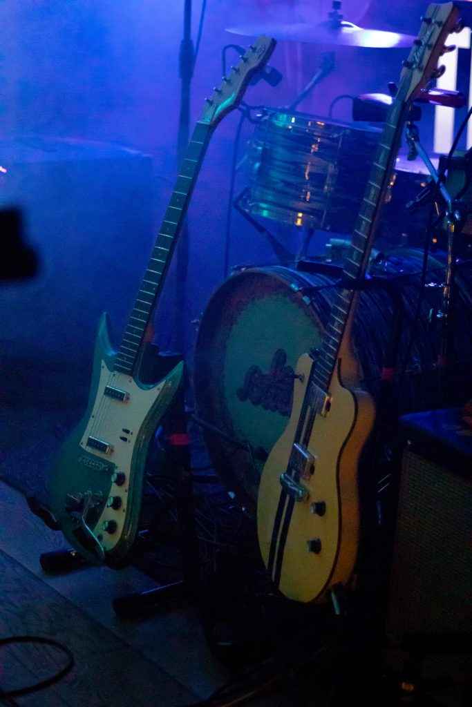 Los Bitchos Serra Petale guitar and drum kit on stage. Eastwood Ichiban K2L Italia guitars