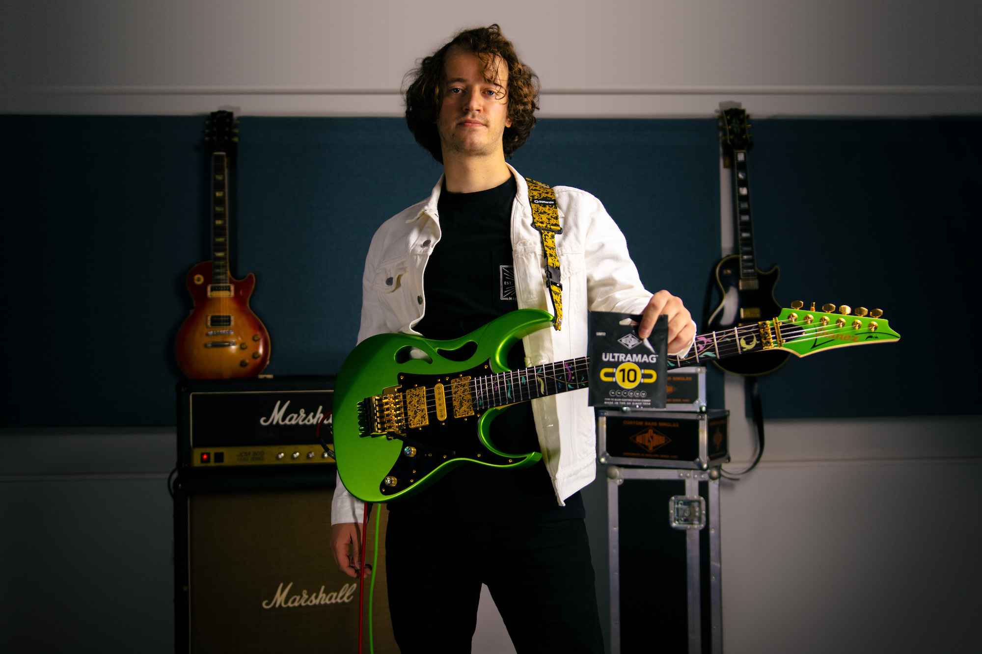 James Ford guitarist with Ibanez Pia guitar in green for Rotosound music strings. Ultramag UM10 guitar player